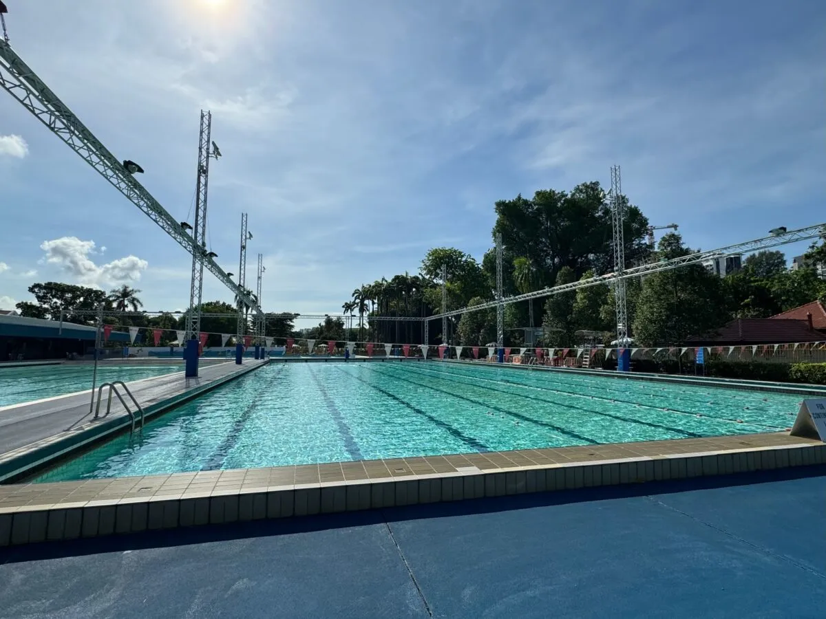 50-metre outdoor competition pool with 10 lanes surrounded by palm trees at Katong Swimming Complex